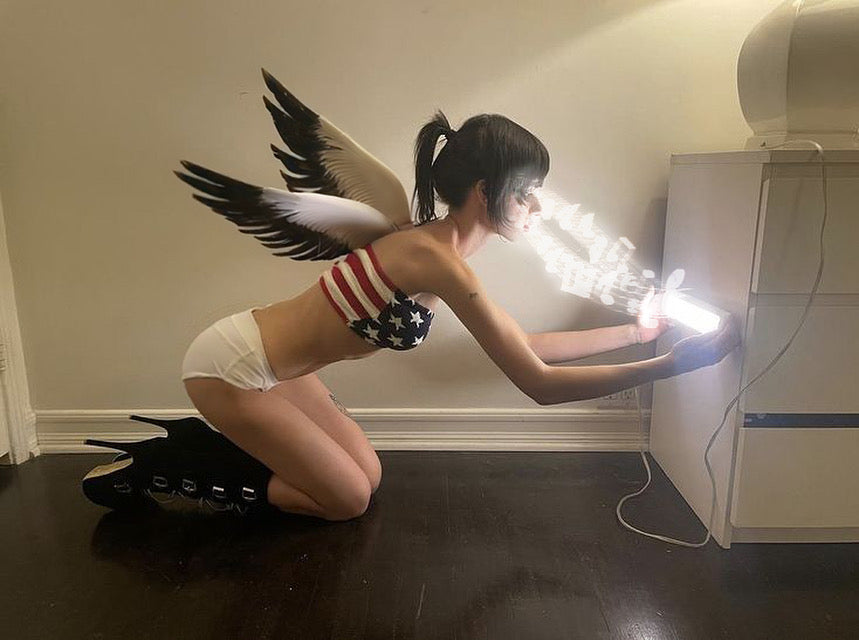 Unity Art Club model with angel wings kneeling